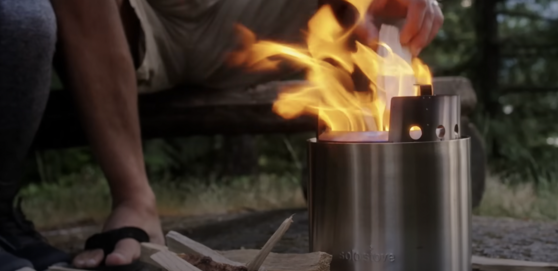 fire pit lit in the forest